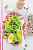 Salad with egg olives and almonds