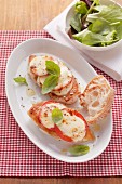 Oven-baked chicken breast with tomatoes and mozzarella