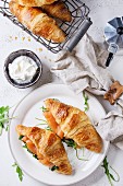 Croissant with smoked salted salmon, spinach and arugula