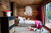 Picture of polar bear in child's bedroom with wooden walls