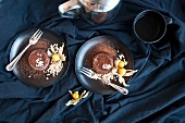 Chocolate lava cakes with almonds and physalis (seen from above)