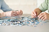 Senior couple doing a jigsaw puzzle