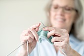 Senior woman knitting