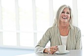 Senior woman with cup of tea