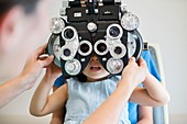 Girl having her eyes tested