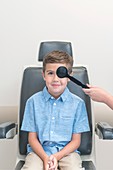 Boy having his eyes tested