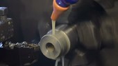 Lubricating metal on a lathe