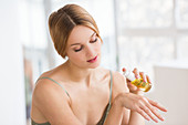 Woman applying sweet almond oil