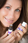 Woman using essential oil