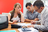 Couple talking to a financial counsellor