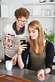 Teenager and elderly woman