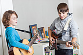 Teenager playing guitar