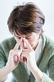 Senior woman suffering from sinusitis