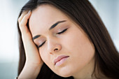 Woman suffering from headache