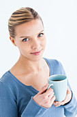 Woman drinking hot beverage