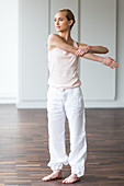 Woman practicing stretching exercises