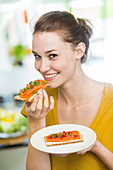 Woman eating salmon