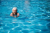 Elderly woman swimming
