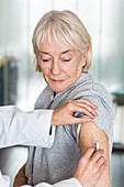 Woman receiving vaccination