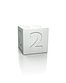 Cube with the number 2 embossed.