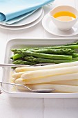 White and green asparagus with butter