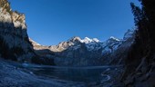 Frozen mountain lake in Switzerland, timelapse