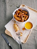 Fish in coconut batter with sweet potato wedges