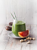 A kale and grapefruit smoothie with dates and cashew pulp (Sirtfood)
