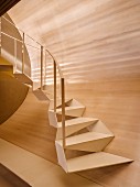 Designer steel stairway with wood-clad wall