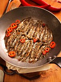 Traditional calabrian recipe, Alici Scattiate, anchovies cooked in a pan with chili, Calabria, Italy