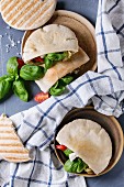 Pita bread sandwiches with grilled vegetables paprika, eggplant, tomato, basil and feta cheese