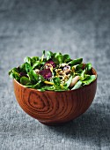 Summer salad with lamb s lettuce and beetroot in a wooden bowl