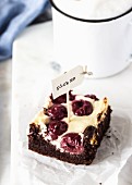 A cheesecake brownie with sour cherries