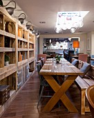 Rustic wooden table and chunky open-fronted shelving