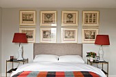 Gallery of etchings in classic bedroom