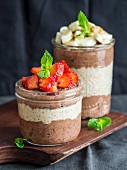 Layered chocolate peanut butter with chia pudding and fresh fruit