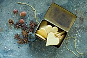 Heart-shaped Christmas cookies in an old tin can