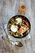 Hearty oat flakes bowl with fruits, goat cheese and thyme