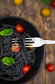 Spaghetti al Nero di Seppia on fork