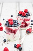 Greek yoghurt with fruit jelly and fresh raspberries and blueberries
