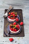 Two mini fancy cakes with berries