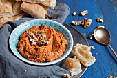 Muhammara (Levantine hot red pepper dip made from walnuts and red peppers) with turkish flatbread
