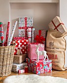 Christmas gifts wrapped in red-patterned paper