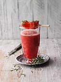 A watermelon drink with rosemary
