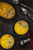 Sweet potato and carrot soup topped with seeds