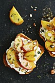 Soft goat's cheese, thyme peaches and hazelnuts on toast