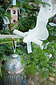 Scroll with ribbon decorating Christmas tree