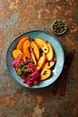 Marinated persimmons with beetroot hummus