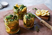 Pickled green almonds with lemons