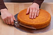 Using a knife to divide a cake base